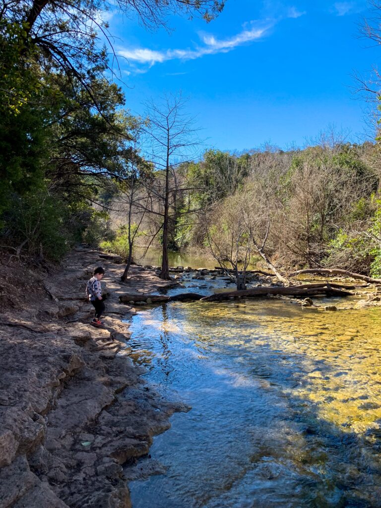 Walking by the water at St. Edward's Park