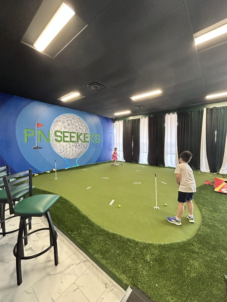 Pin Seeker's Golf Lounge putting green